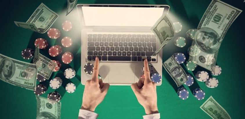 Person Online Gambling with Laptop